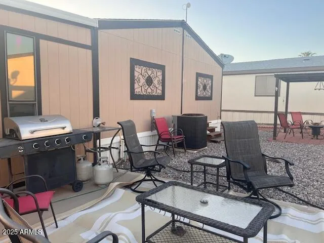 a living room with furniture a piano and a window