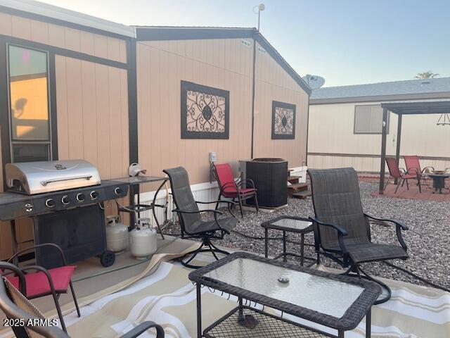 301 South Signal Butte Road, Unit 233 Apache Junction, AZ 85120 - Photo 21 of 22 a living room with furniture a piano and a window
