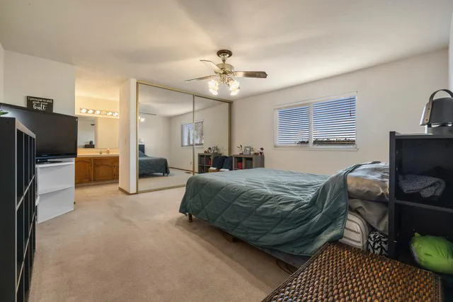 a bathroom with a shower sink and mirror
