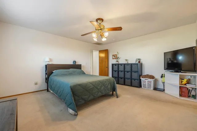 a bathroom with a shower and toilet