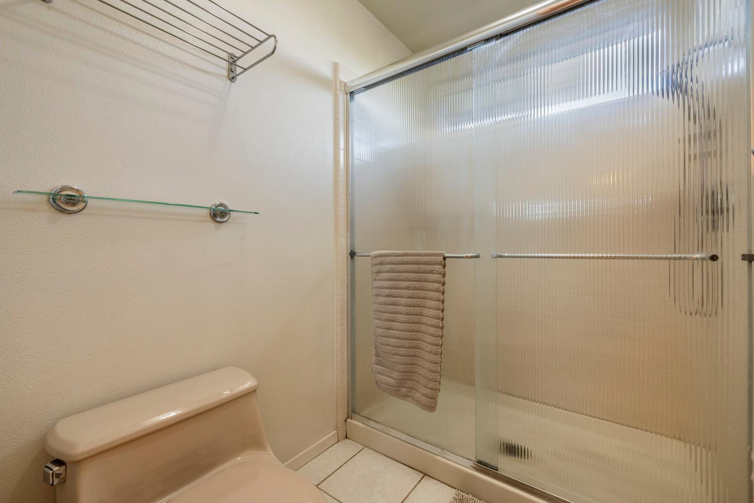 24836 Arthur Road Escalon, CA 95320 - Photo 21 of 47 a bathroom with a shower and toilet