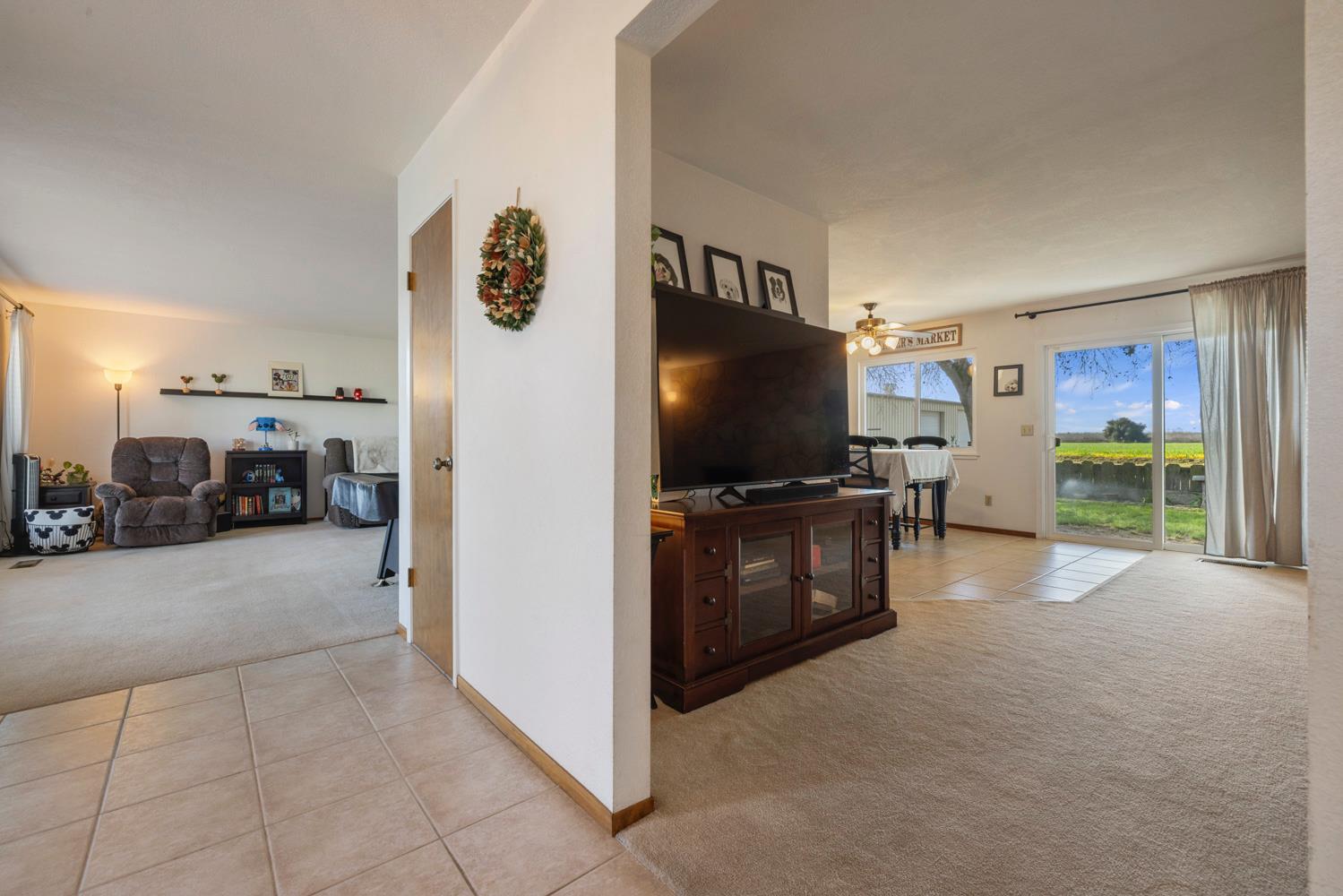 24836 Arthur Road Escalon, CA 95320 - Photo 22 of 47 a view of a livingroom with furniture and a flat screen tv