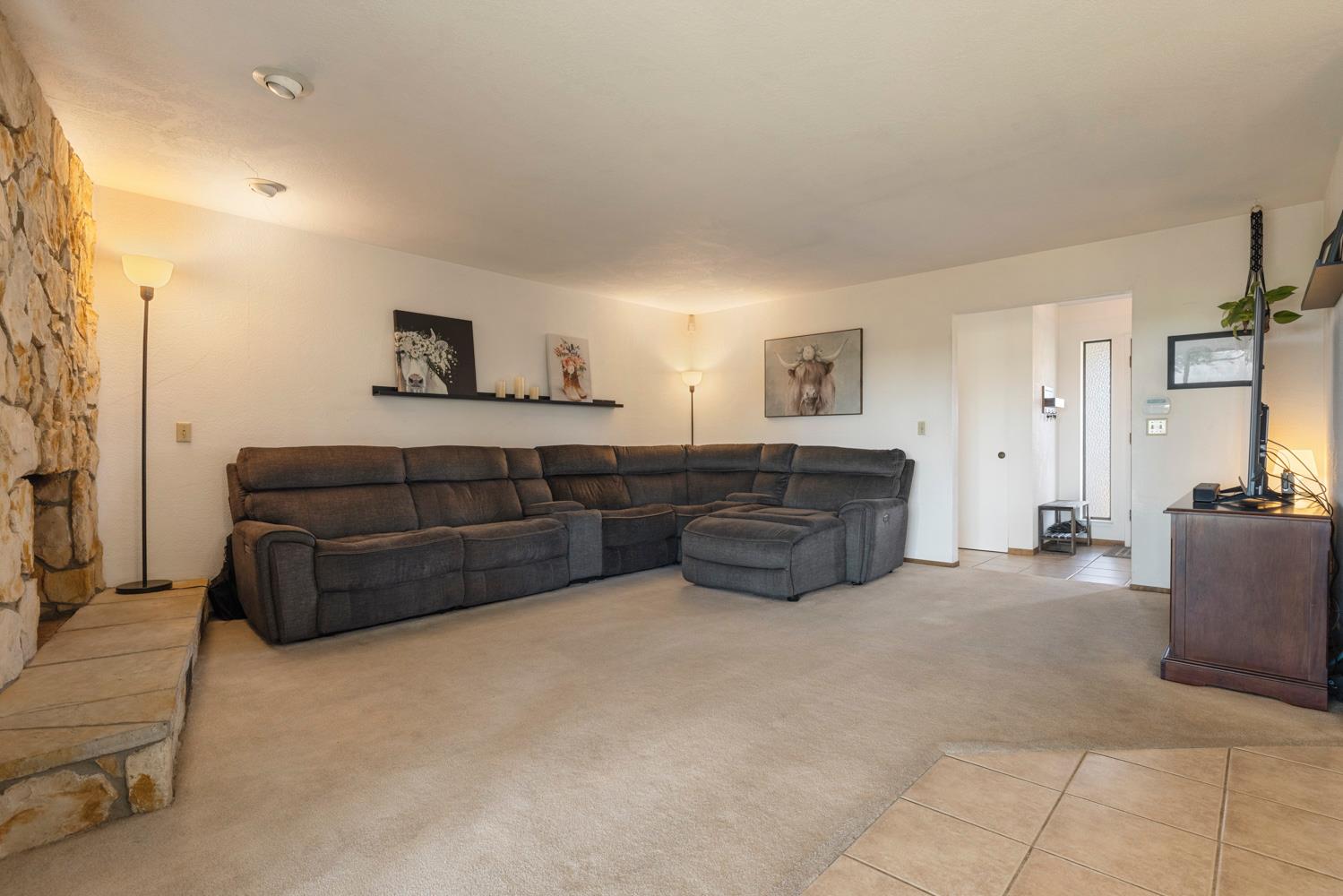 24836 Arthur Road Escalon, CA 95320 - Photo 24 of 47 a living room with furniture and a couch