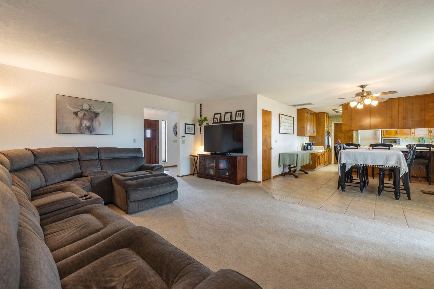 24836 Arthur Road Escalon, CA 95320 - Photo 25 of 47 a living room with furniture and a flat screen tv