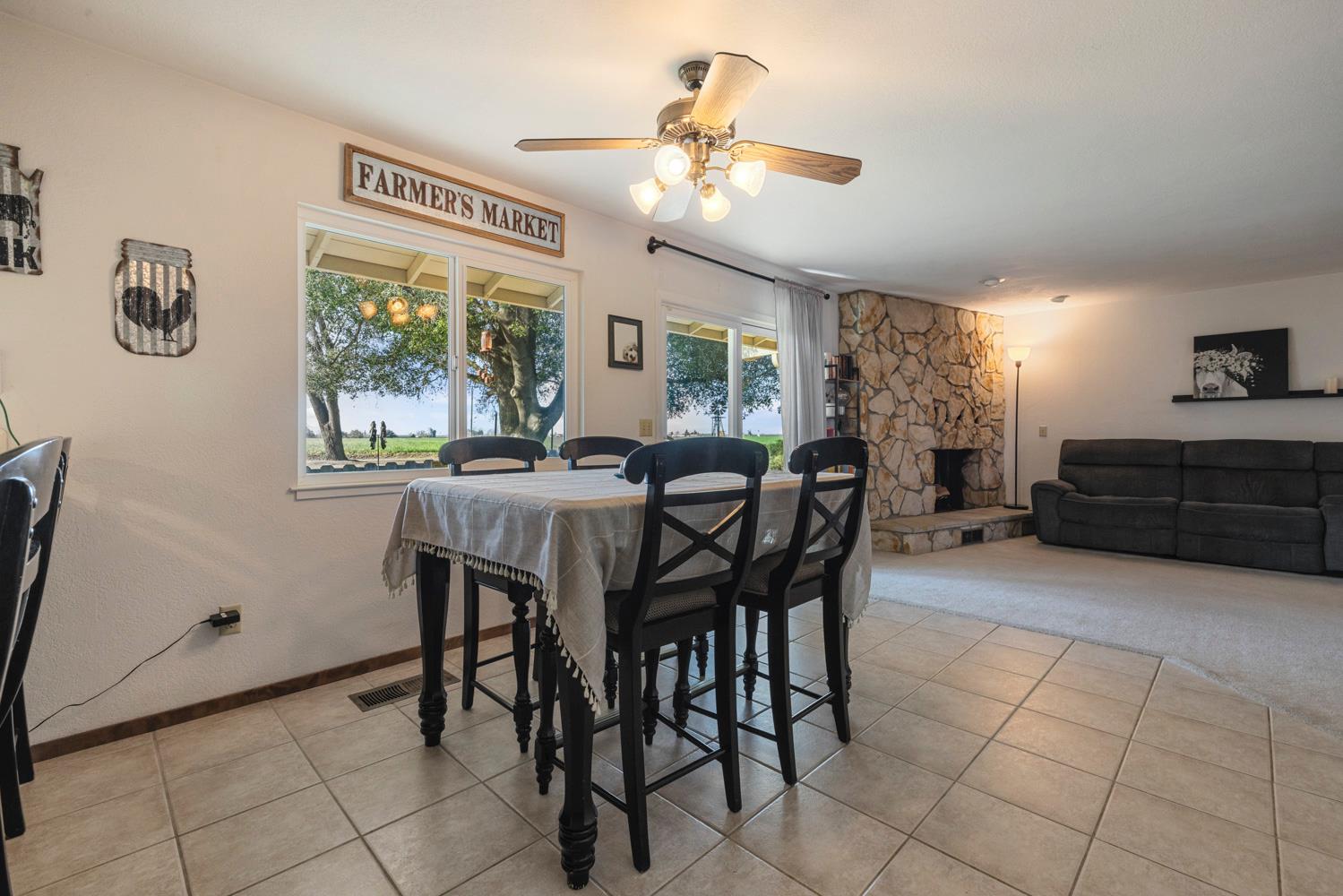 24836 Arthur Road Escalon, CA 95320 - Photo 27 of 47 a view of a dining room with furniture and a chandelier