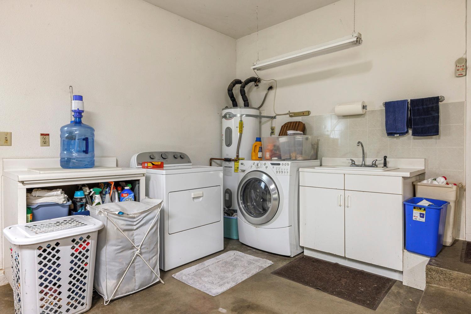 24836 Arthur Road Escalon, CA 95320 - Photo 33 of 47 a utility room with sink dryer and washer
