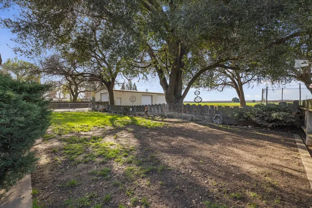 a view of backyard with garage