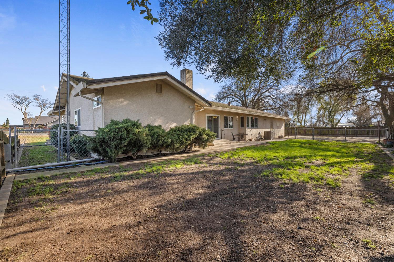 24836 Arthur Road Escalon, CA 95320 - Photo 35 of 47 a house view with swimming pool and garden space