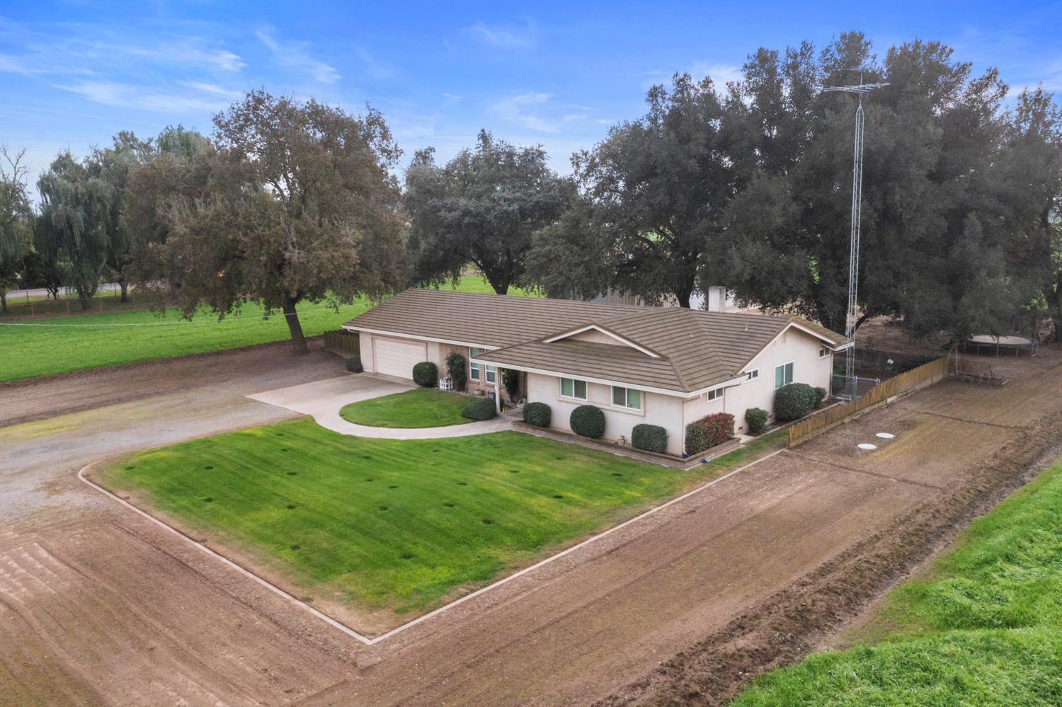 24836 Arthur Road Escalon, CA 95320 - Photo 46 of 47 an aerial view of a house with yard and green space