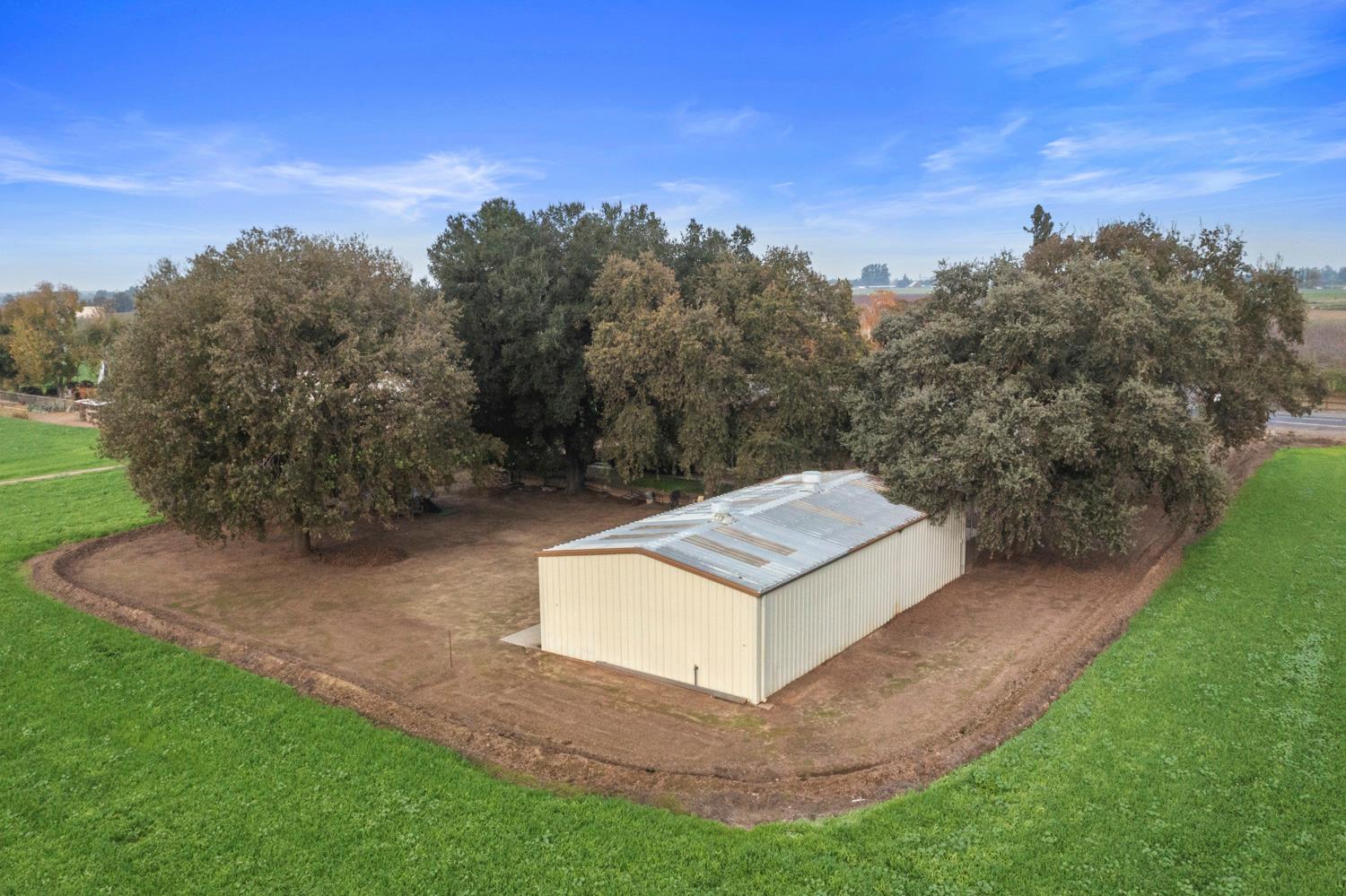 24836 Arthur Road Escalon, CA 95320 - Photo 47 of 47 a view of a yard with a house in the background