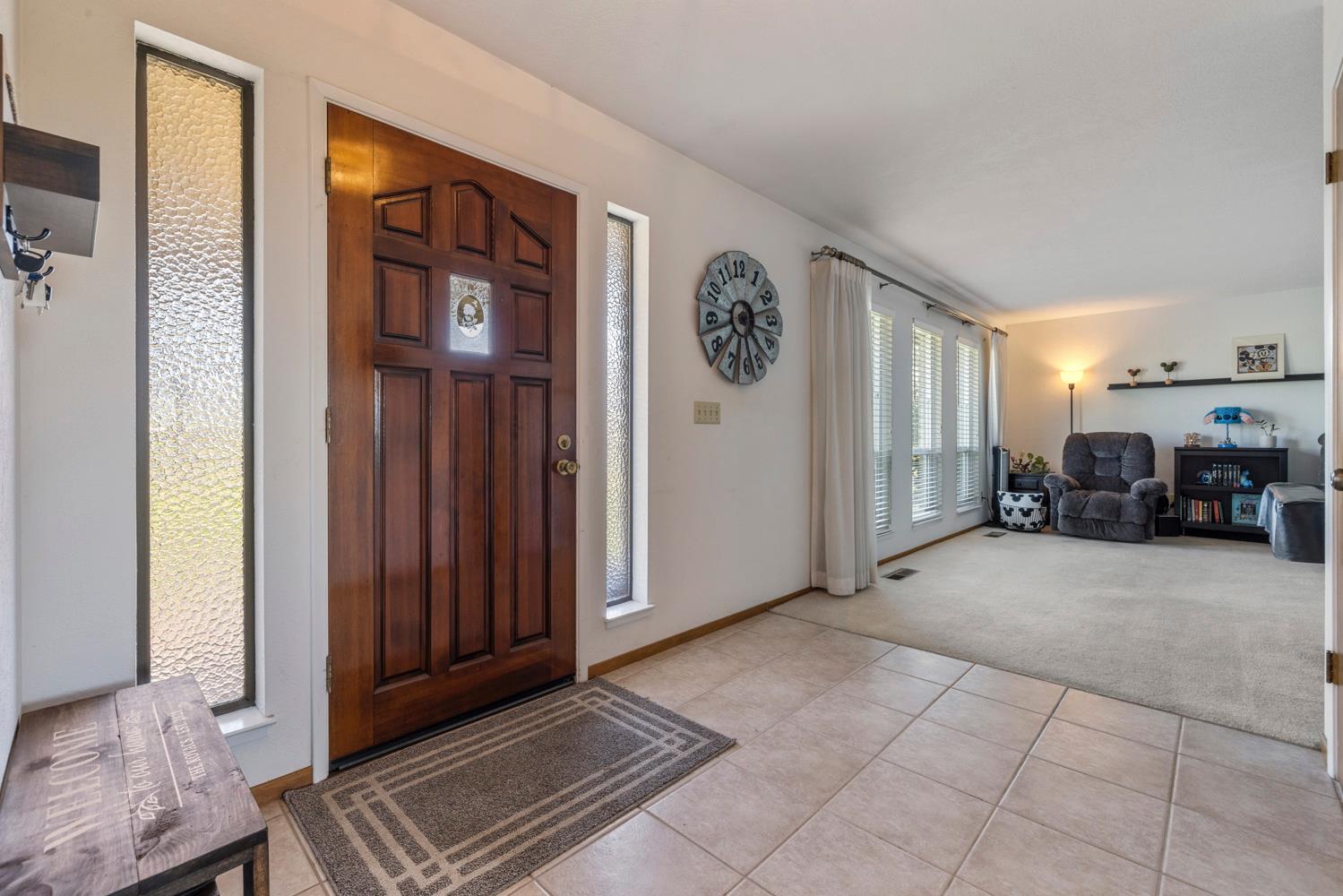 24836 Arthur Road Escalon, CA 95320 - Photo 6 of 47 a view of a livingroom with furniture and windows