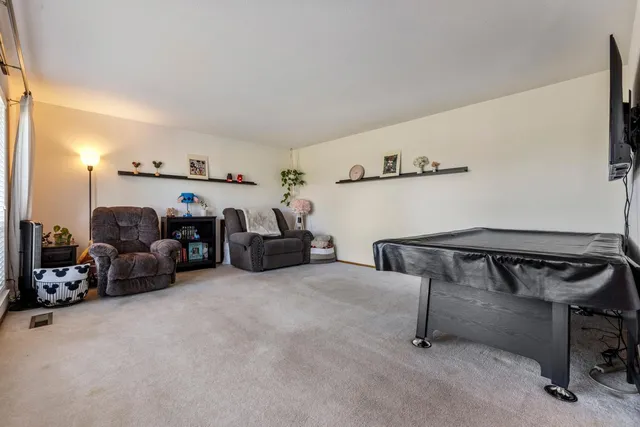a living room with furniture and a table