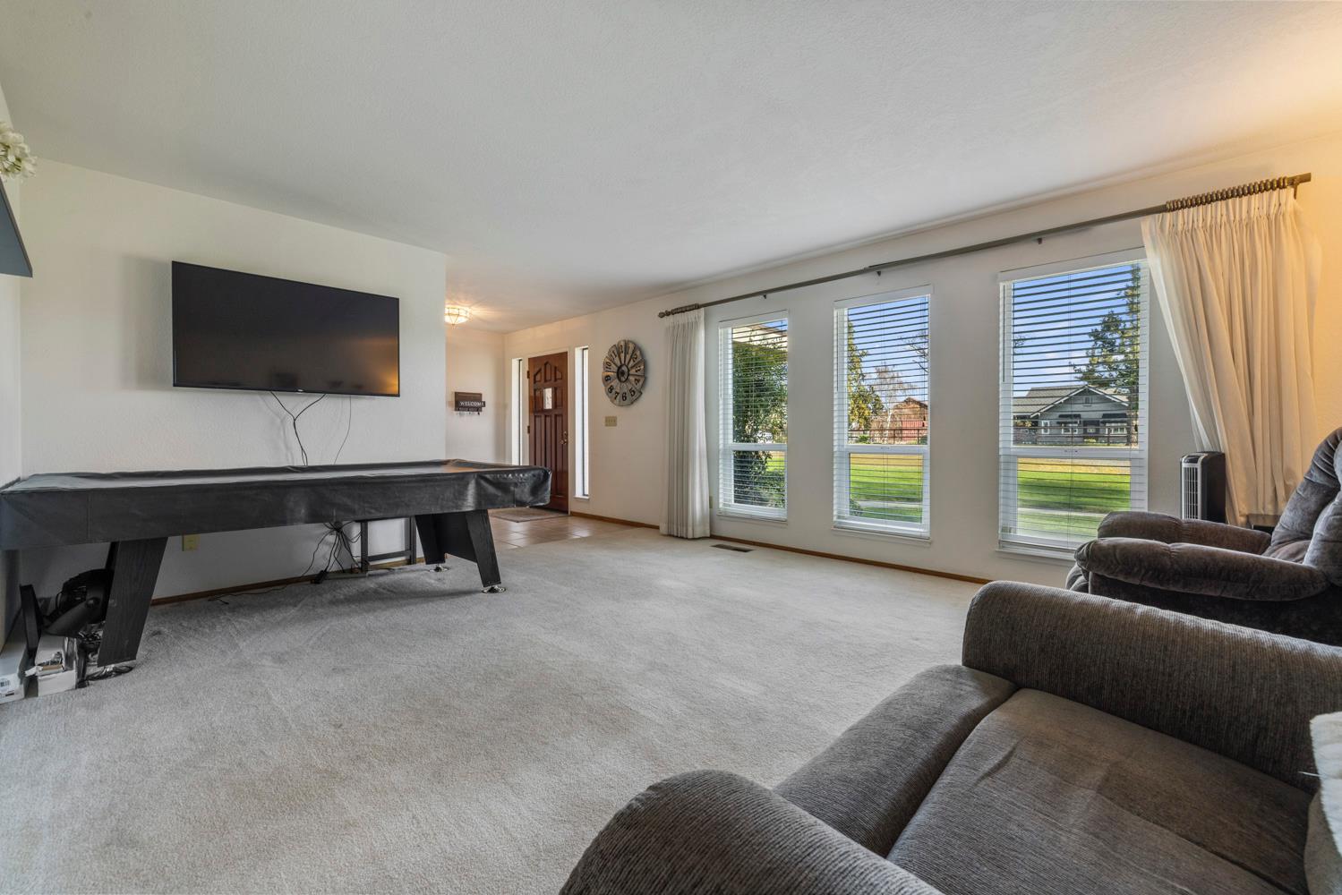 24836 Arthur Road Escalon, CA 95320 - Photo 8 of 47 a living room with furniture and a flat screen tv