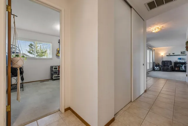 a view of a livingroom with furniture and a window