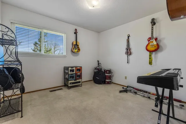 a room with furniture and gym equipment