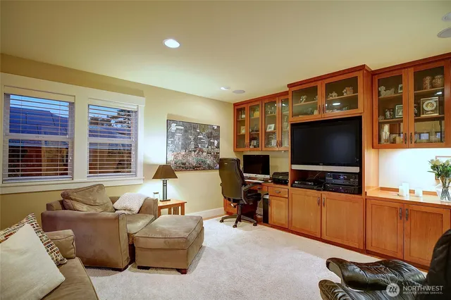 a bathroom with a sink mirror vanity and toilet