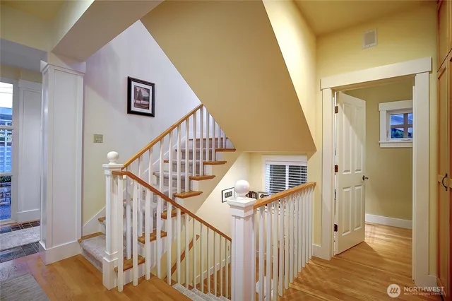 a living room with furniture and a book shelf