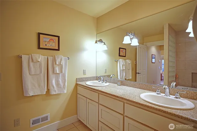 a bedroom with a bed and chair