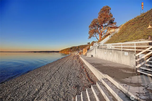 an aerial view of residential houses with outdoor space and swimming pool