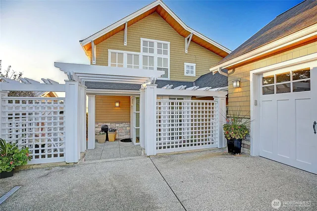 a view of a porch with chairs and a yard