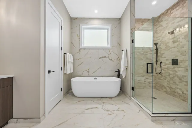 a bathroom with a bathtub and shower