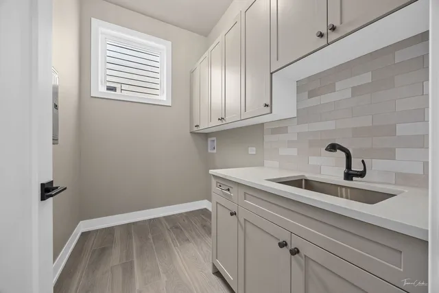 a kitchen with a sink and cabinets