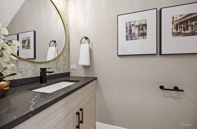 a bathroom with a sink and mirror