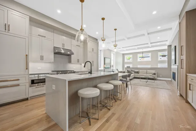 a large kitchen with a table and chairs in it