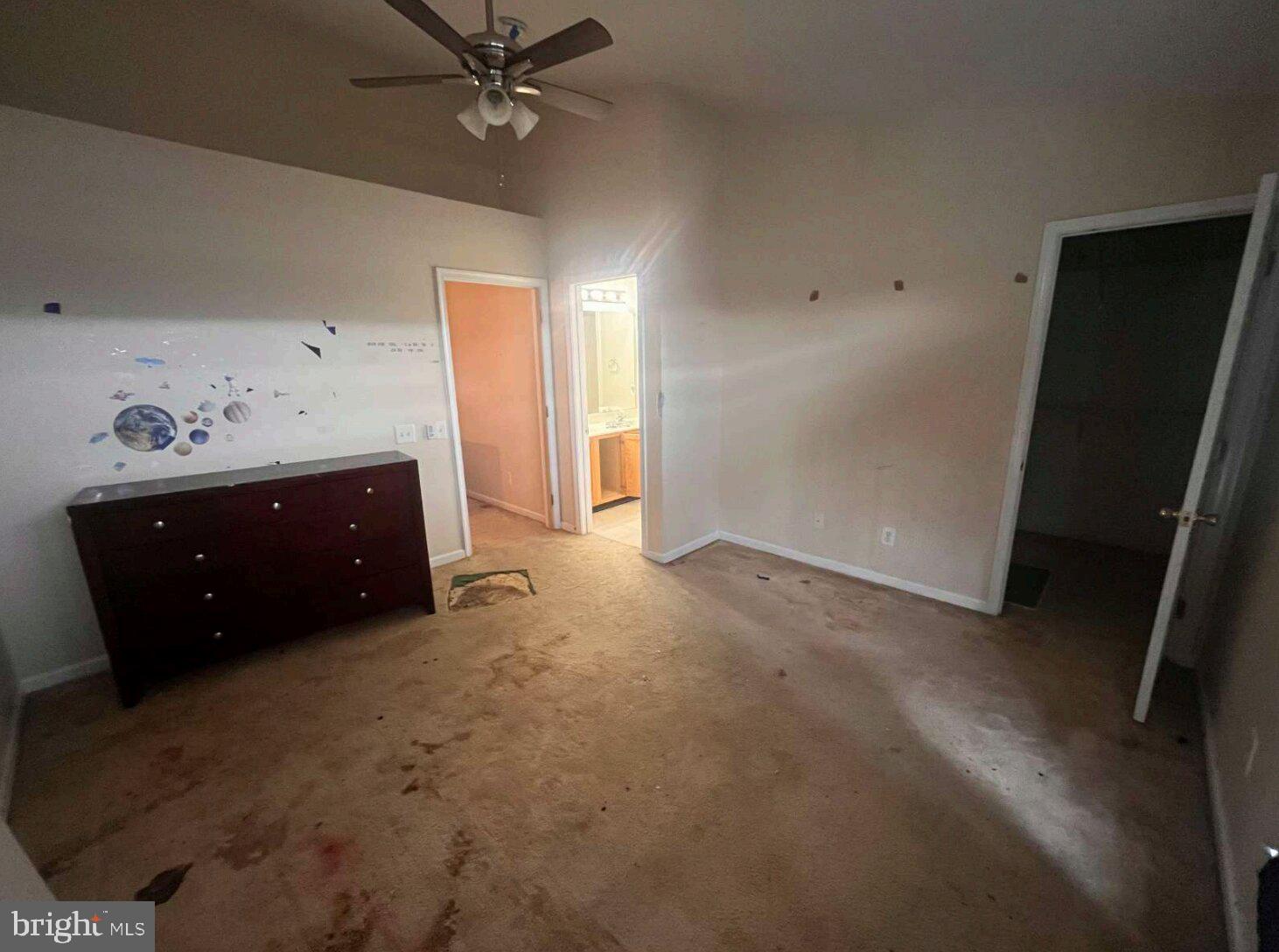 54 Lisa Drive Newark, DE 19702 - Photo 7 of 8 an empty room with a ceiling fan and a window