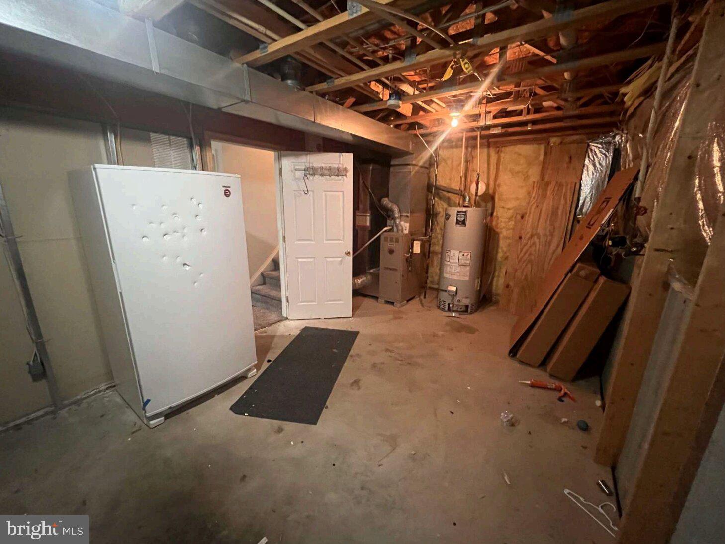 54 Lisa Drive Newark, DE 19702 - Photo 8 of 8 a view of storage and utility room with refrigerator
