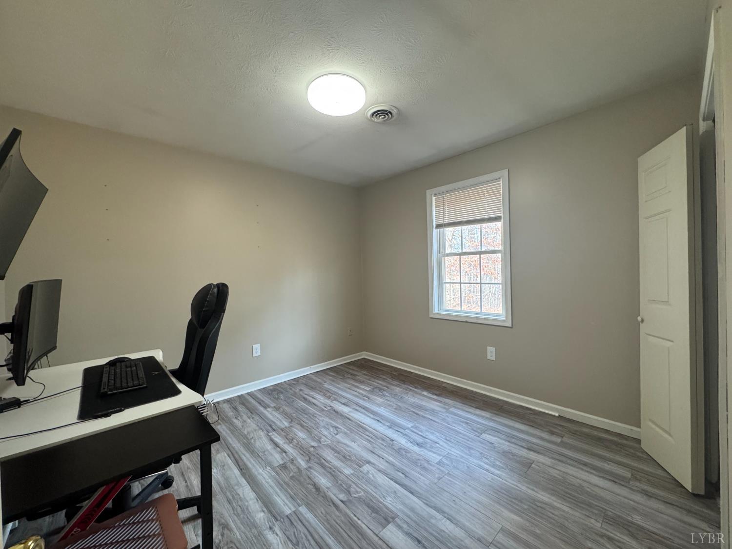 3363 Horseshoe Road Appomattox, VA 24522 - Photo 11 of 15 a view of a workspace with furniture and a window