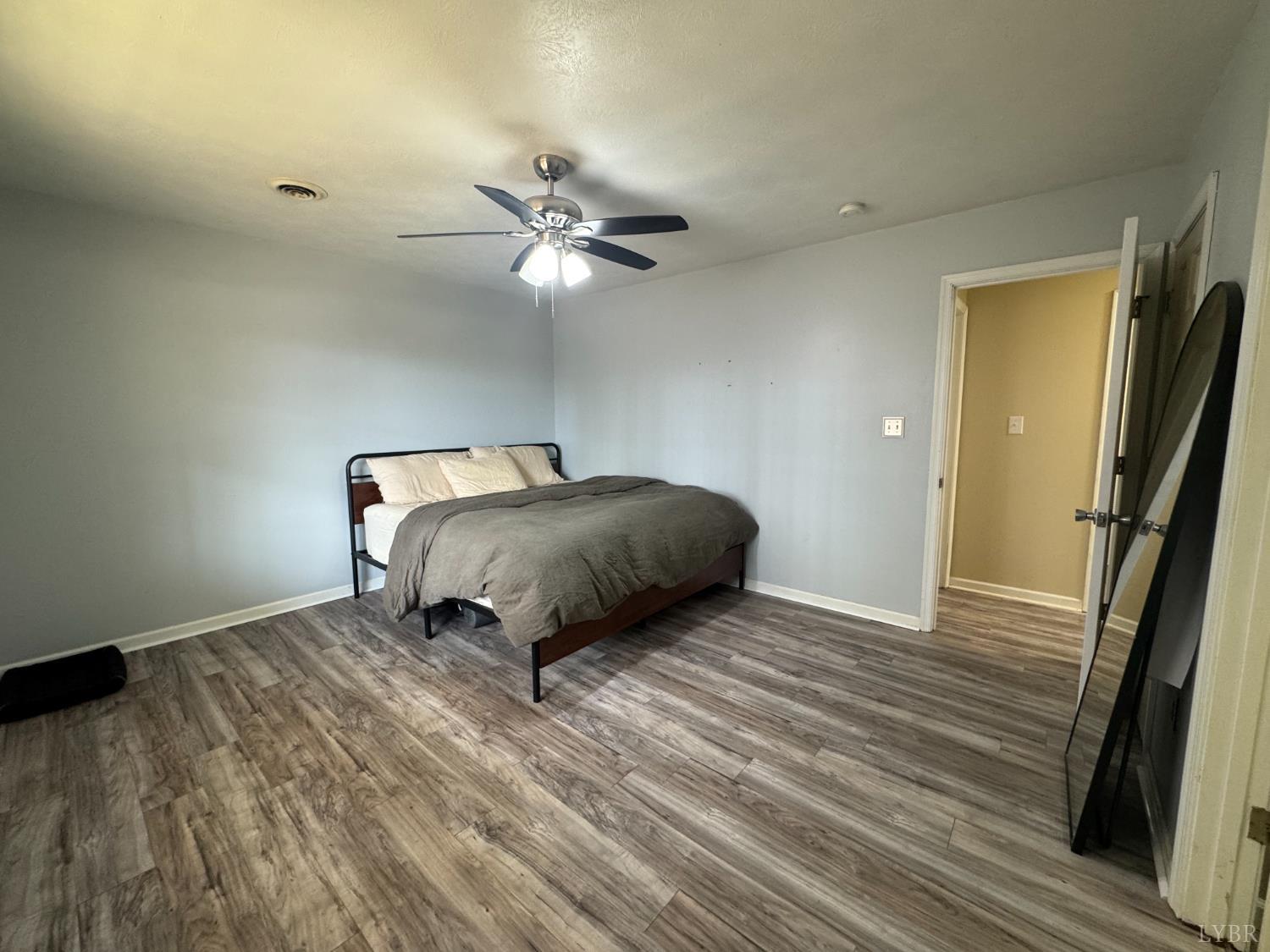 3363 Horseshoe Road Appomattox, VA 24522 - Photo 11 of 15 a bedroom with a bed and a ceiling fan