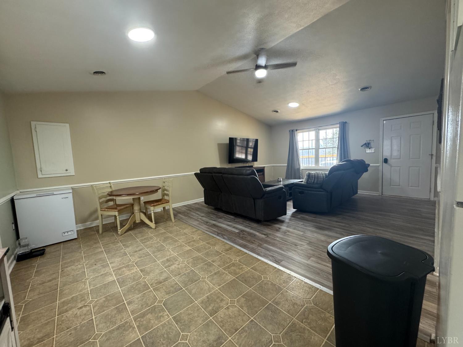 3363 Horseshoe Road Appomattox, VA 24522 - Photo 5 of 15 a living room with furniture and a chandelier