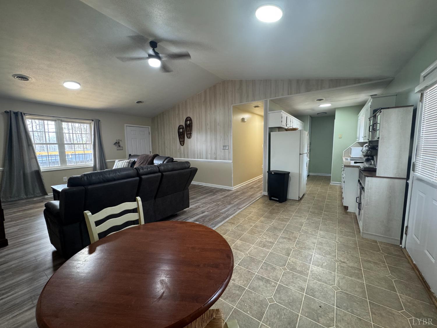 3363 Horseshoe Road Appomattox, VA 24522 - Photo 7 of 15 a living room with furniture and a chandelier