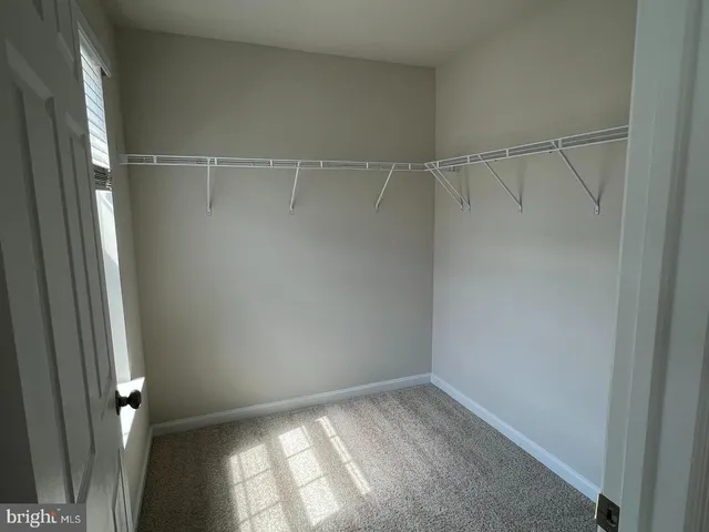 an empty room with a windows