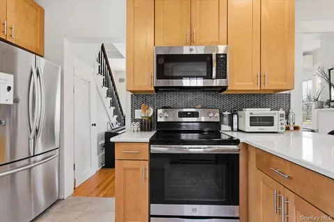 a kitchen with a stove and a microwave