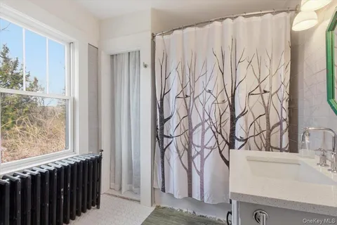 a bathroom with a bathtub and shower