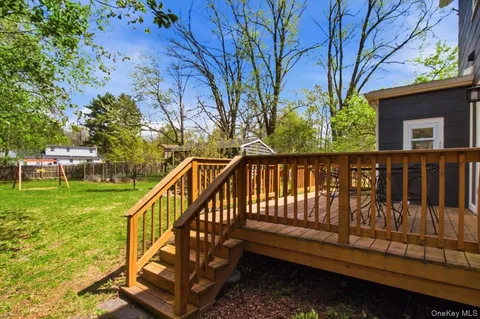 a view of a wooden deck with a bench