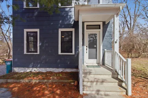 a view of a house with a door and a outdoor space