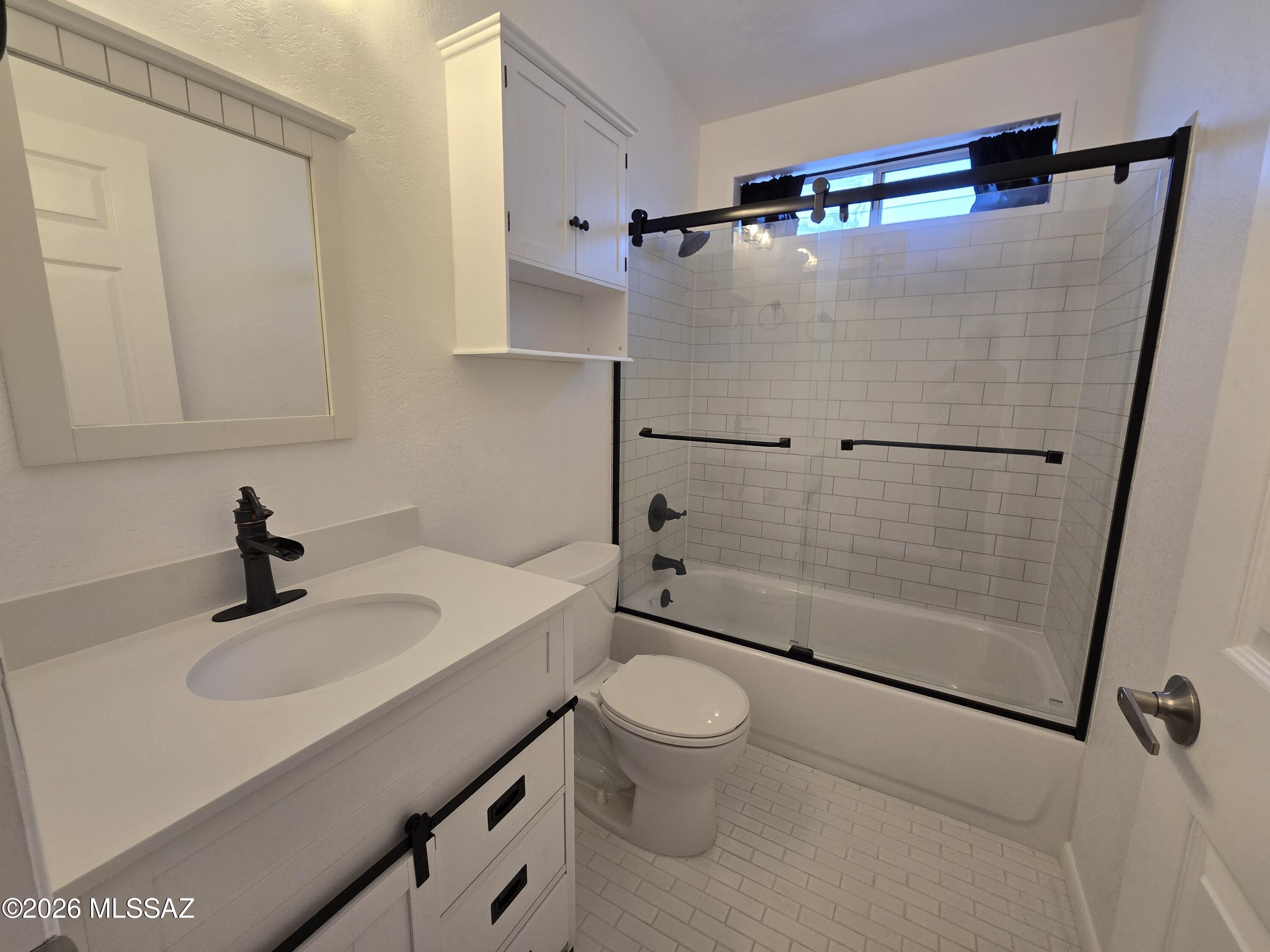 8401 South Kolb Road, Unit 61 Tucson, AZ 85756 - Photo 6 of 23 a bathroom with a sink toilet and shower