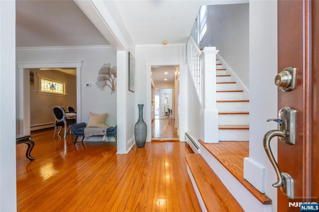 690 Garden Street Maywood, NJ 07607 - Photo 5 of 49 a dining room with wooden floor and furniture