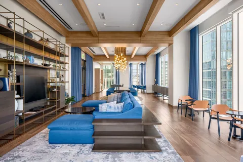 a living room with fireplace furniture and a flat screen tv