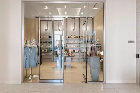a bathroom with a glass shower door