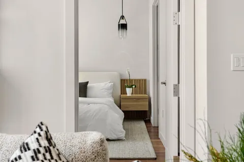 a bedroom with a bed and a couch