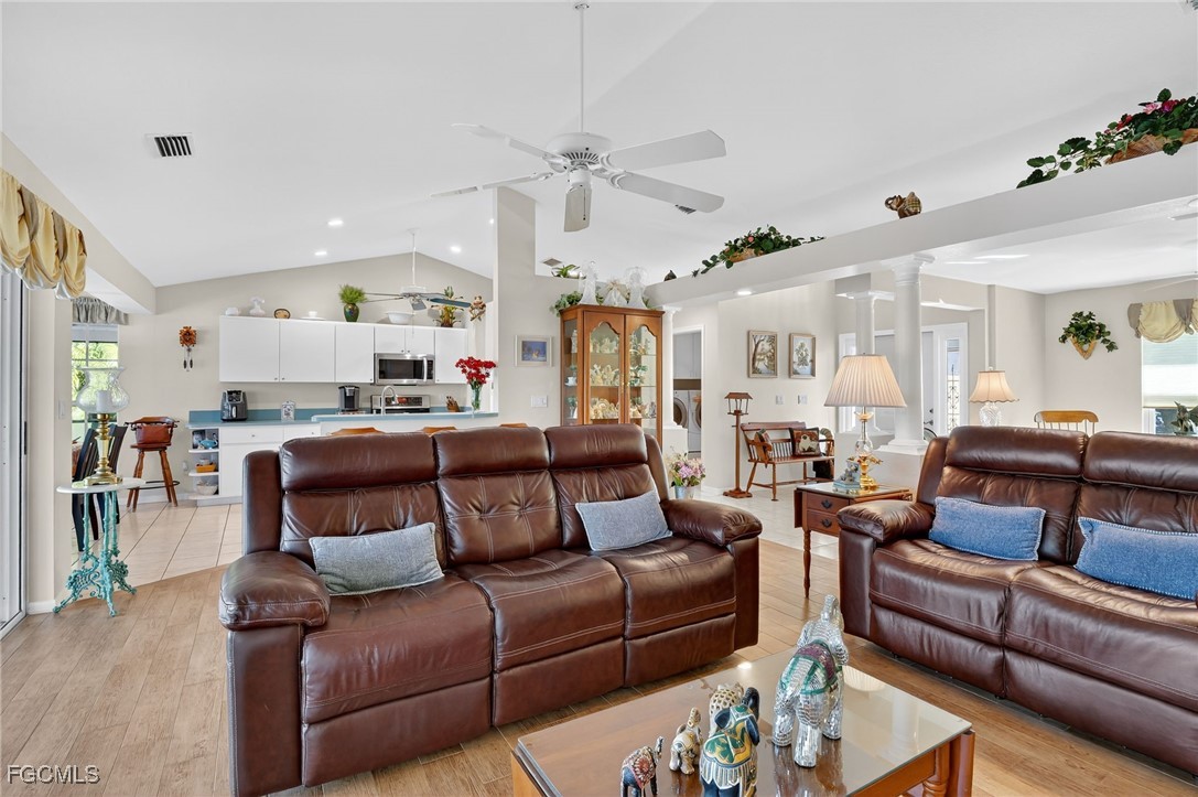 4306 Southwest 3rd Avenue Cape Coral, FL 33914 - Photo 9 of 50 a living room with furniture and a wooden floor