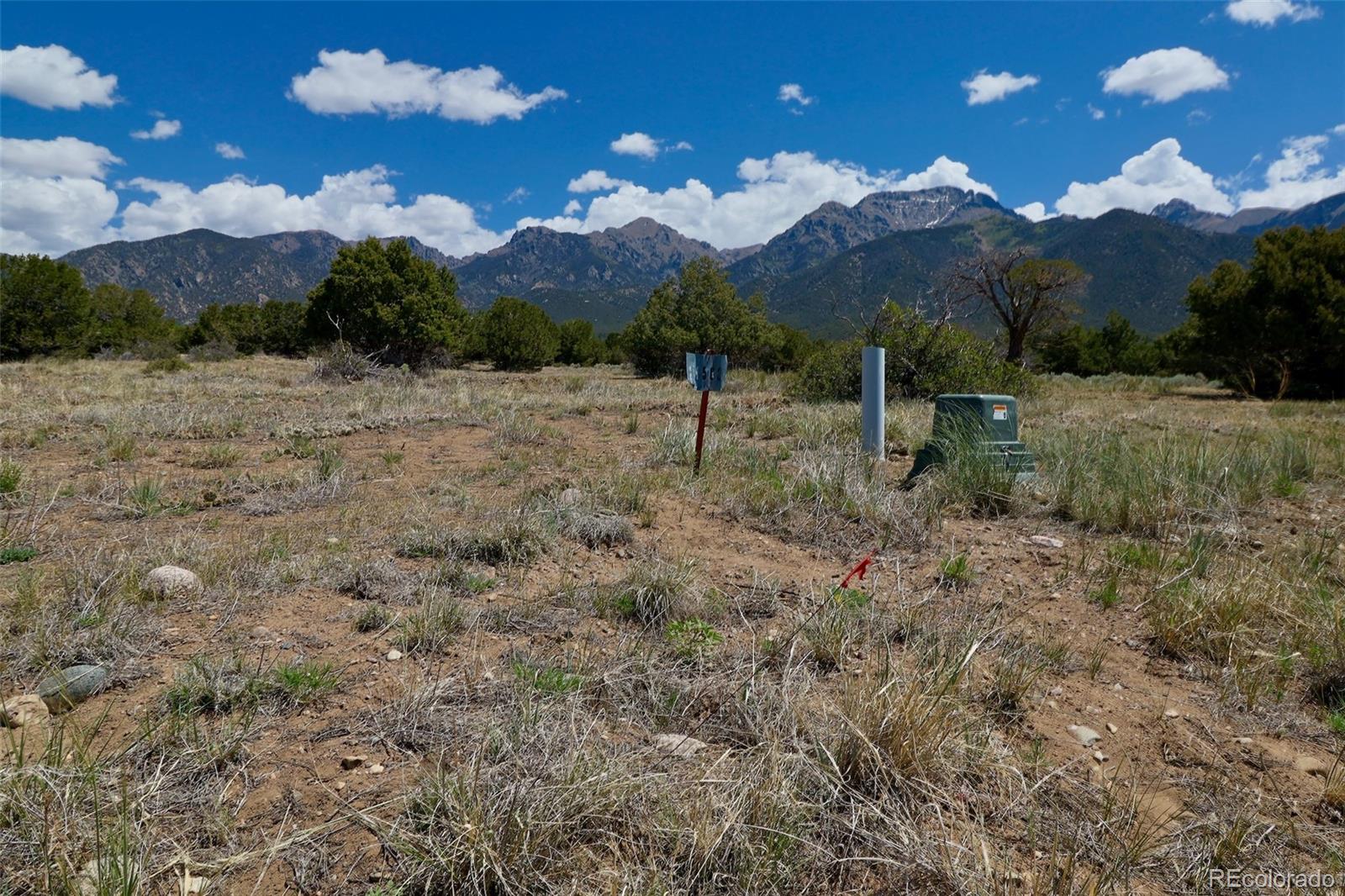 1563 Wagon Wheel Road Crestone, CO 81131 - Photo 7 of 10 a view of a backyard of a house
