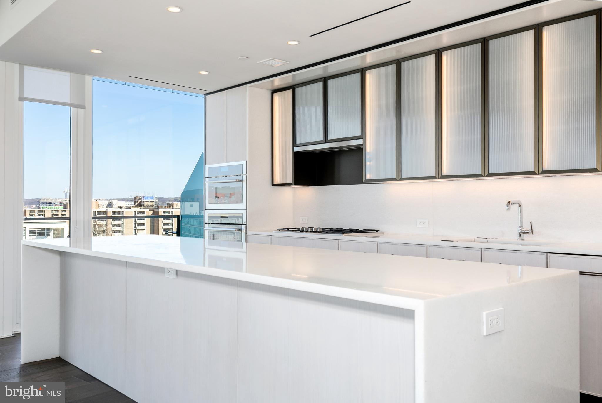 601 Wharf Street Southwest, Unit 1005 Washington, DC 20024 - Photo 8 of 19 a kitchen with stainless steel appliances a sink and a stove top oven