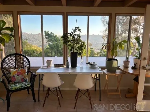 a view of a dining room with furniture window and outside view