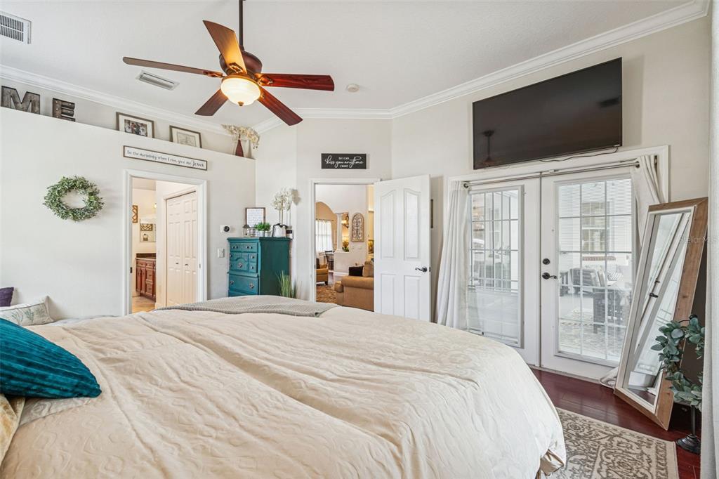 3077 Cork Road Plant City, FL 33565 - Photo 41 of 99 a bedroom with a bed window and a flat screen tv