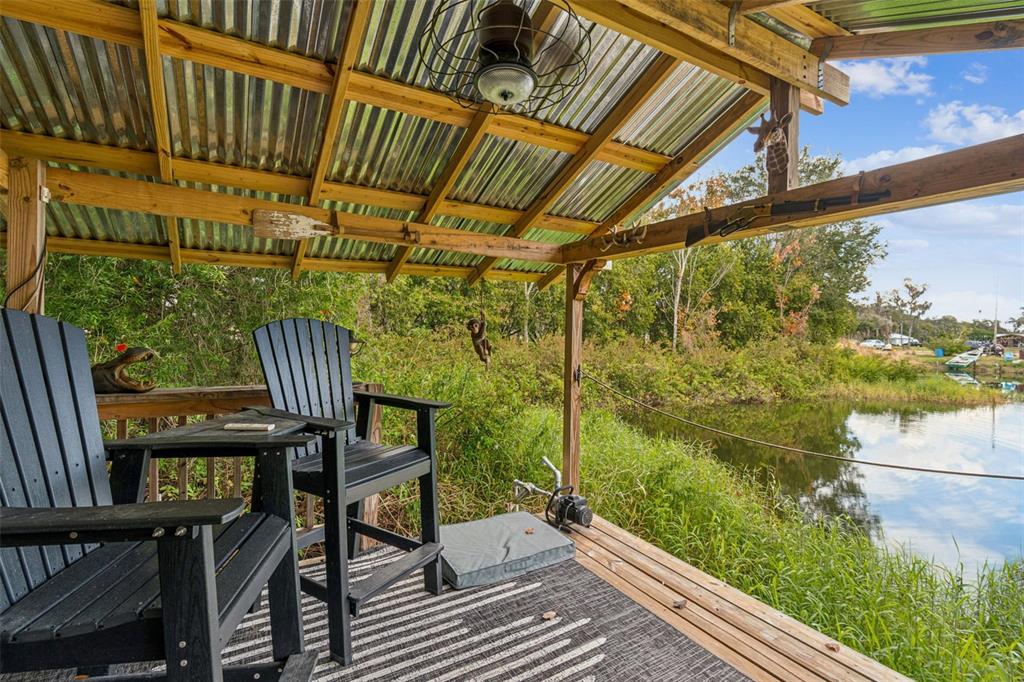 3077 Cork Road Plant City, FL 33565 - Photo 5 of 99 a view of a chairs and table in the balcony